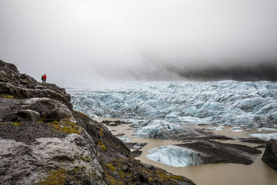 Scenic view of glacier against sky