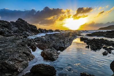 Scenic view of sea against sky during sunset