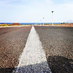 Surface level of road against the sky