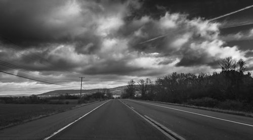 Road against cloudy sky