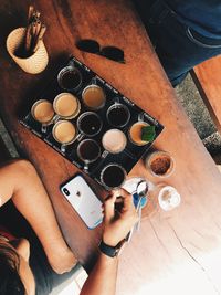 High angle view of man holding ice cream on table