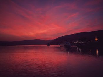 Scenic view of sea against romantic sky at sunset