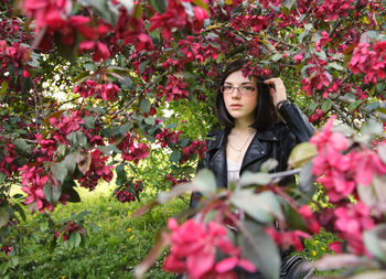 Portrait of woman with pink flowers