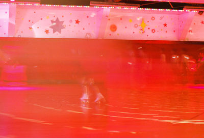 Low section of people in illuminated red light