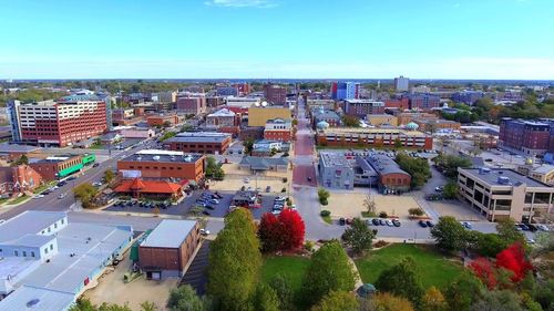 High angle view of town against blue sky