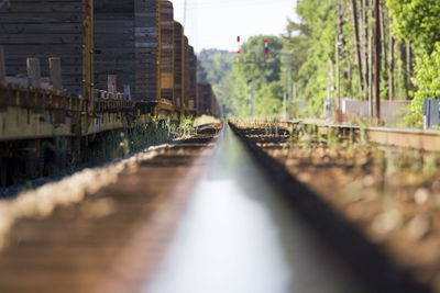 Train on railroad track during sunny day