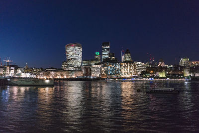 Illuminated buildings in city at night