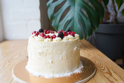 Fruit cake on wooden background on the table 