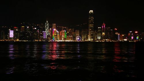 Illuminated buildings victoria harbor at night