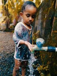 Cute girl playing with water