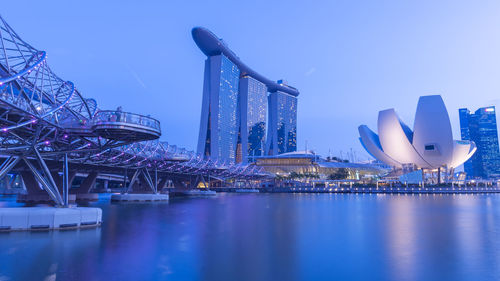 Illuminated city at waterfront