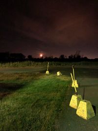 Scenic view of field against sky at night