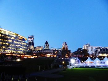 Illuminated buildings in city at night