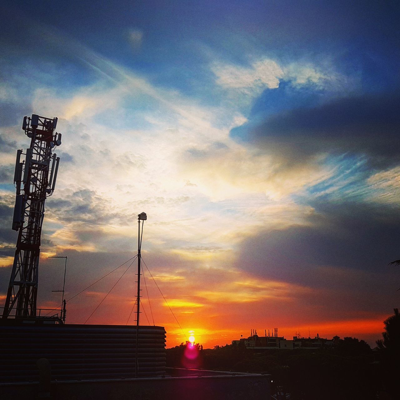 sky, sunset, cloud - sky, architecture, built structure, orange color, nature, silhouette, building exterior, no people, beauty in nature, industry, outdoors, low angle view, factory, technology, sun, sunlight, scenics - nature, building, construction equipment