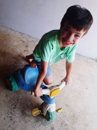 Portrait of cute boy playing with toy