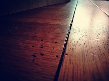 Close-up of wooden table on hardwood floor