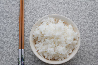 Directly above shot of rice and chopsticks