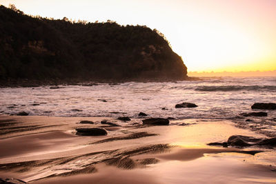 Scenic view of sea at sunset