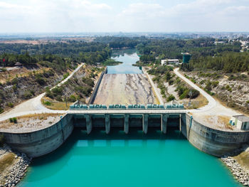 Aerial view of water reservoir, concrete rapid and closed reservoir locks of a dam. berdan dam