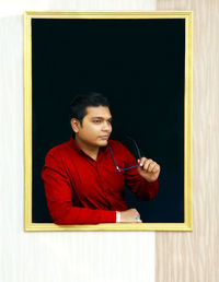 Portrait of young man looking at camera