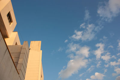 Low angle view of buildings against blue sky