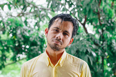 Portrait of man against plants