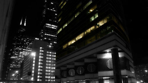 Low angle view of modern building at night