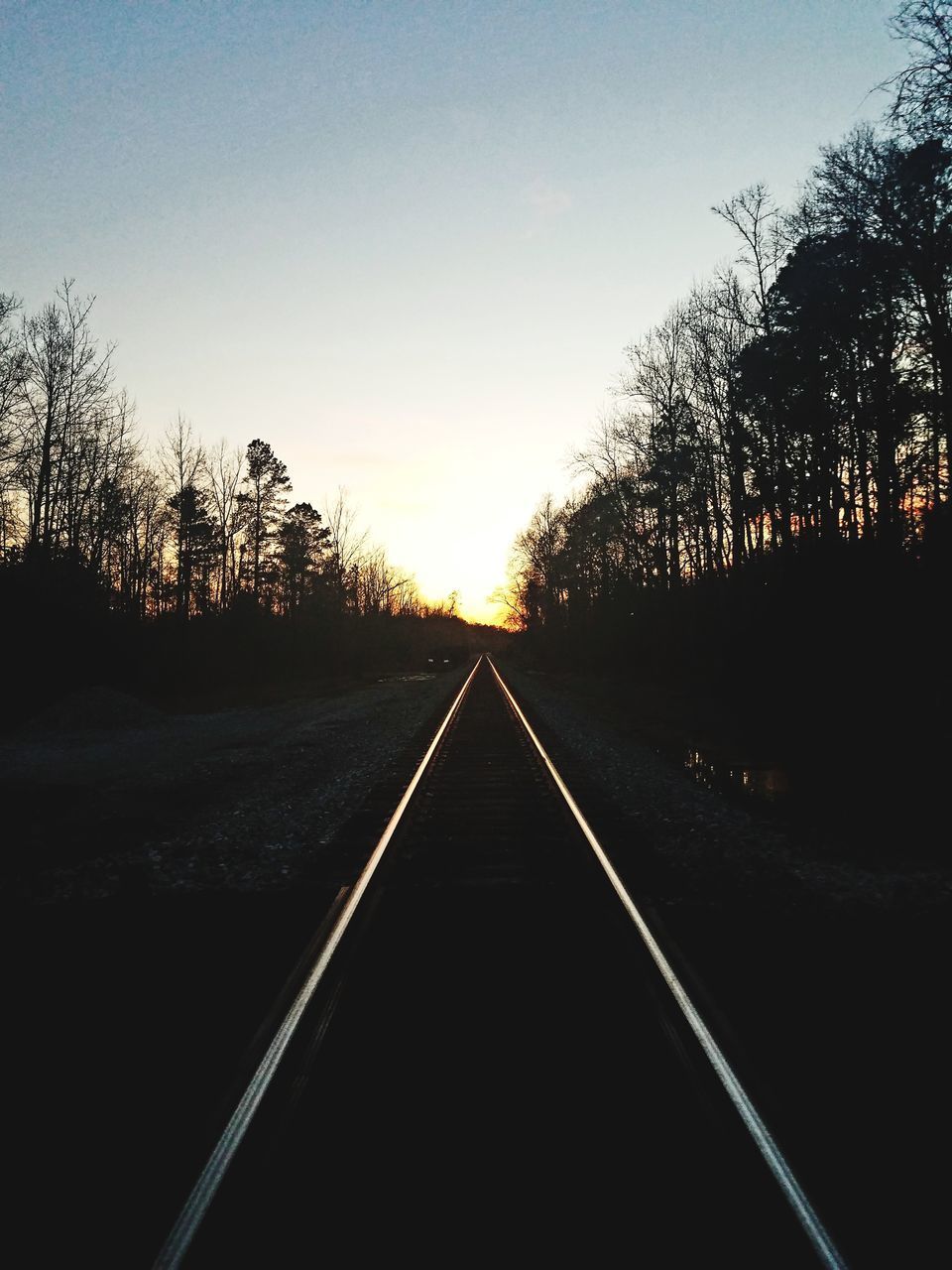 VIEW OF RAILROAD TRACK AGAINST SKY