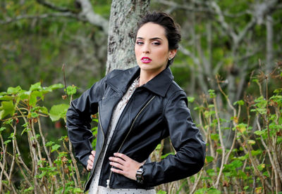 Portrait of beautiful woman standing on land