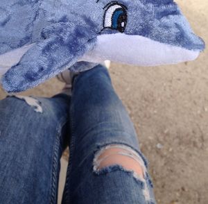 Low section of woman standing on ground