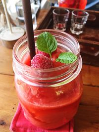 Close-up of strawberries in glass on table