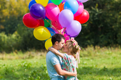 Full length of girl with balloons