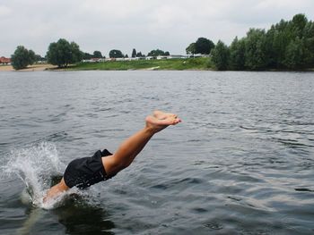 Man diving in river