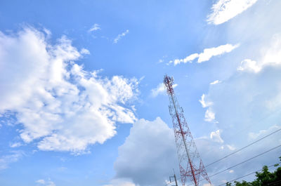 Low angle view of communications tower against sky