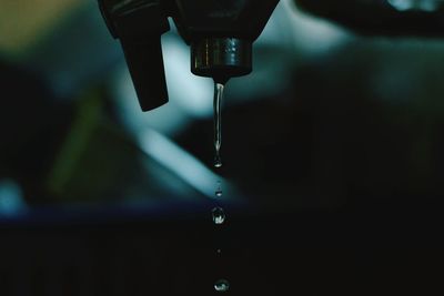 Close-up of dripping tap