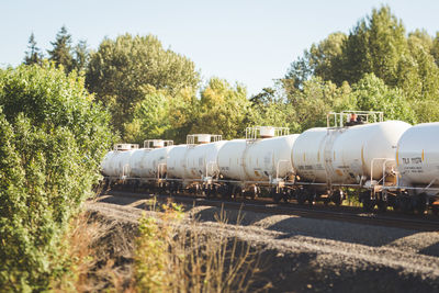 Freight transportation train on track against sky