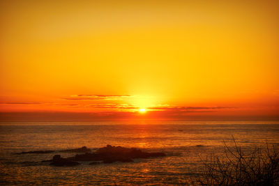 Scenic view of sea at sunset