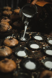 Cropped hands of woman preparing food in kitchen