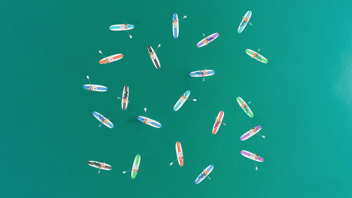 High angle view of people kayaking on sea