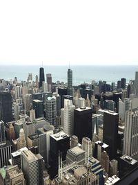 Aerial view of cityscape against clear sky