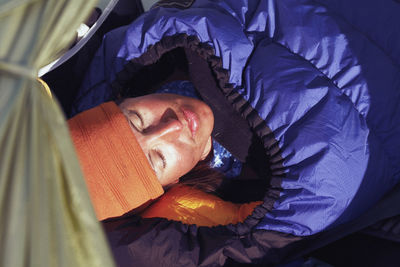 Woman sleeping in sleeping bag