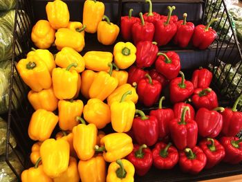 Red bell peppers for sale at market stall