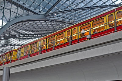 Low angle view of red train at railroad station