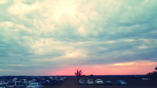 Road against cloudy sky at sunset