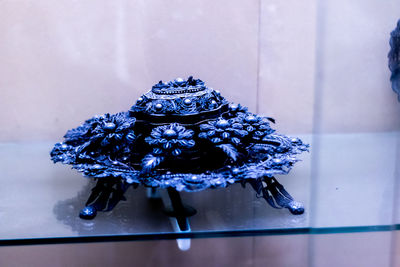 Close-up of wilted flower on table