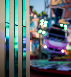 Close-up of illuminated lighting equipment in city at night