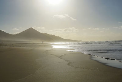 Scenic view of beach against sky