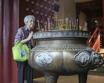 Full length of woman looking at temple