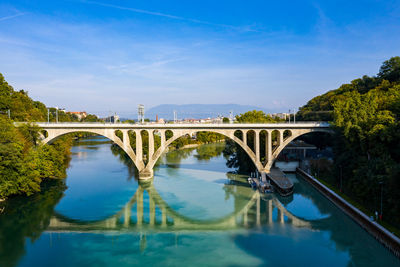 Bridge over river against blue sky