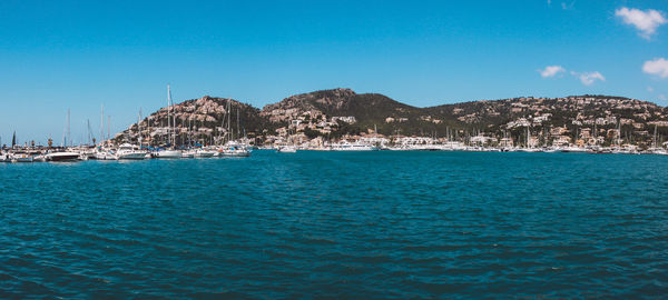 Scenic view of sea against clear blue sky